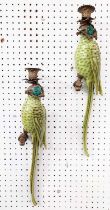 WALL SCONCES, a pair, in the form of parrots, glazed ceramic, gilt mounts, 47cm L each. (2)