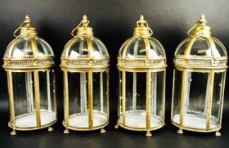 STORM LANTERNS, a set of four, Regency style, gilt metal, 46cm H x 19cm diam. (4)