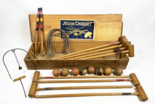 JEU DE CROQUET SET, comprising 8 clubs, 8 balls, 10 hoops one with bell and start and end posts in