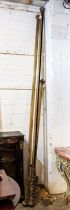 CURTAIN POLES, brass, three, one approx 305cm, one approx 185cm, one approx 290cm, two with rings,