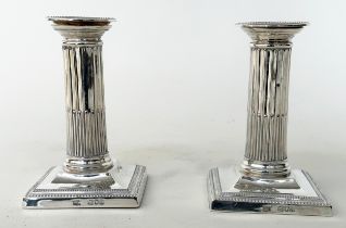 CANDLESTICKS BY MAPPIN AND WEBB, a pair, silver stop fluted columns and square bases 1899, London,