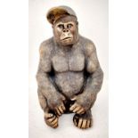 GORILLA WEARING A BASEBALL CAP, 60cm H x 40cm W x 34cm D, faux bronze finished resin.