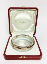 A CARTIER GLASS AND SILVER RIM CONDIMENT BOWL, complete with original box, 10cm diam.