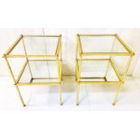 SIDE TABLES, 57cm high, 38cm wide, a pair, 1960s French style, gilt metal, glass top with mirrored