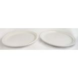 CERAMIC PLATES, a near pair, in a clear glaze, with a beaded border, 50cm D. (2)