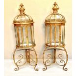 STORM LANTERNS ON STANDS, 115cm H x 34cm diam., Regency style, gilt metal frames. (2)