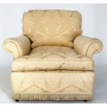 ARMCHAIR, Howard style gold brocade upholstery with scroll arm and feather filled cushion pads, 92cm