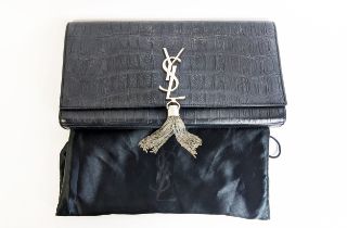 YVES SAINT LAURENT CLUTCH, embossed leather body, metal iconic logo with tassel closure, front
