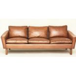 SOFA, 1970's Danish, grained tan leather and teak supports, 206cm W approx.