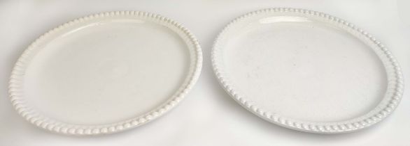 CERAMIC PLATES, a near pair, in a clear glaze, with a beaded border, 50cm D. (2)