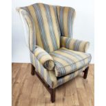 A GEORGE III STYLE WING BACK ARMCHAIR, hand made by Hart Villa Interiors, striped fabric upholstery,