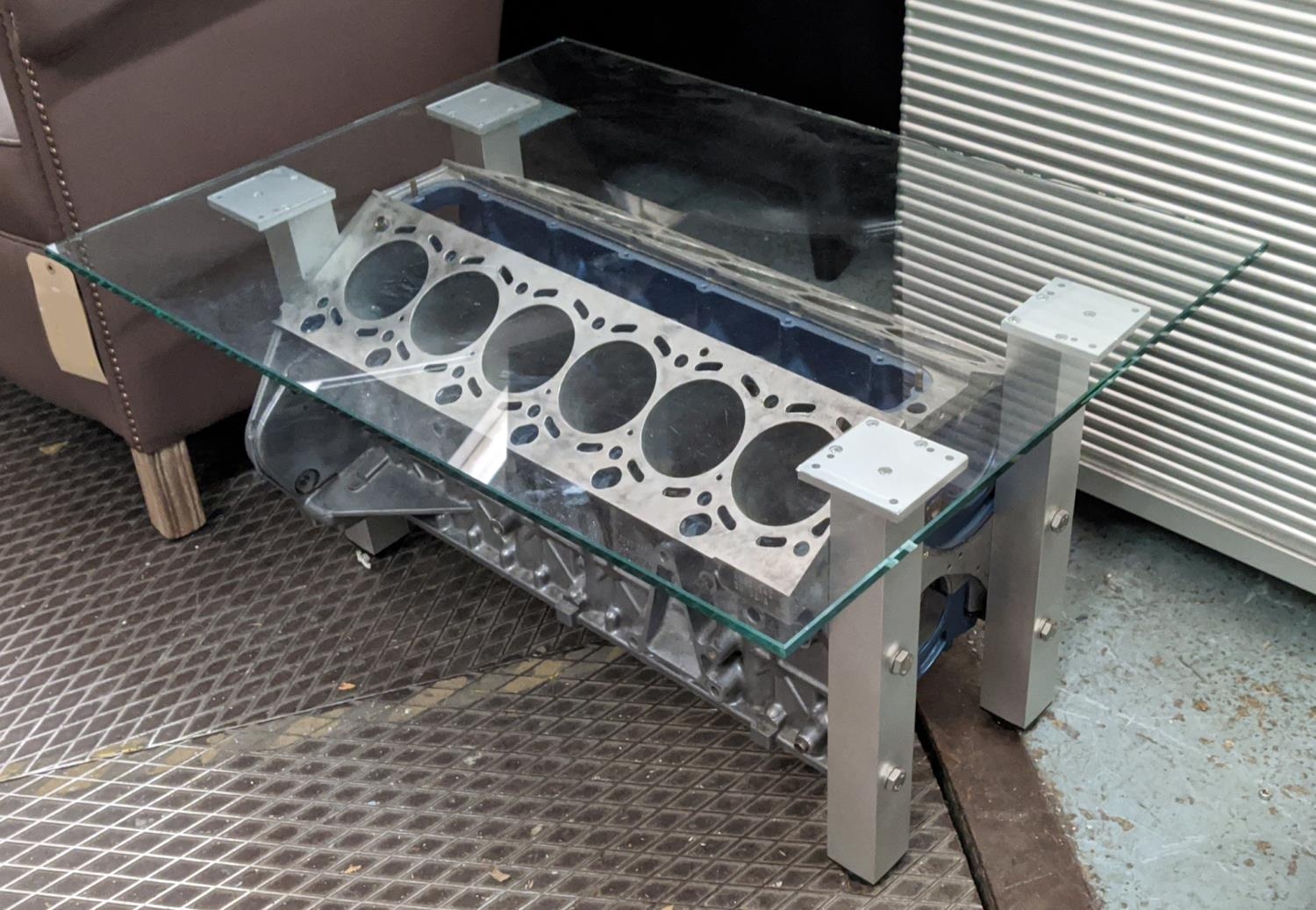 BMW V12 ENGINE BLOCK LOW TABLE, 60cm D x 43cm H x 80cm H , glass top on an engine block base.