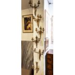 WALL SCONCES, a set of three, Louis XVI style gilt metal with urn detail, each 40cm H x 31cm W, a