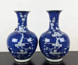 VASES, a pair, 37cm H blue and white glazed ceramic with prunus decoration. (2)