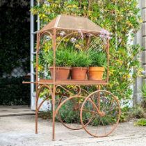 PLANT STAND, 152cm x 98cm x 70cm, in the form of a vintage cart, aged metal finish.