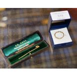 9 CARAT GOLD ETERNITY STYLE RING & GOLD STICK PIN WITH BOX - APPROXIMATE COMBINED WEIGHT = 2.5 GRAMS