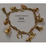 9 CARAT GOLD CHARM BRACELET - APPROXIMATE WEIGHT = 16.1 GRAMS