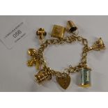 9 CARAT GOLD CHARM BRACELET - APPROXIMATE WEIGHT = 25.8 GRAMS