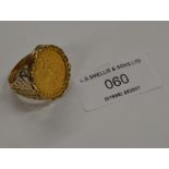 9 CARAT GOLD RING SET WITH A FULL 1974 SOVEREIGN - APPROXIMATE WEIGHT = 13.8 GRAMS