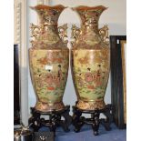 PAIR OF LARGE DECORATIVE ORIENTAL VASES ON WOODEN STANDS
