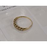 9 CARAT GOLD 7 STONE DIAMOND RING - APPROXIMATE WEIGHT = 1.7 GRAMS