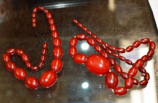 2 GRADUATED STRINGS OF VINTAGE CHERRY BAKELITE BEADS - APPROXIMATE WEIGHT = 110 GRAMS