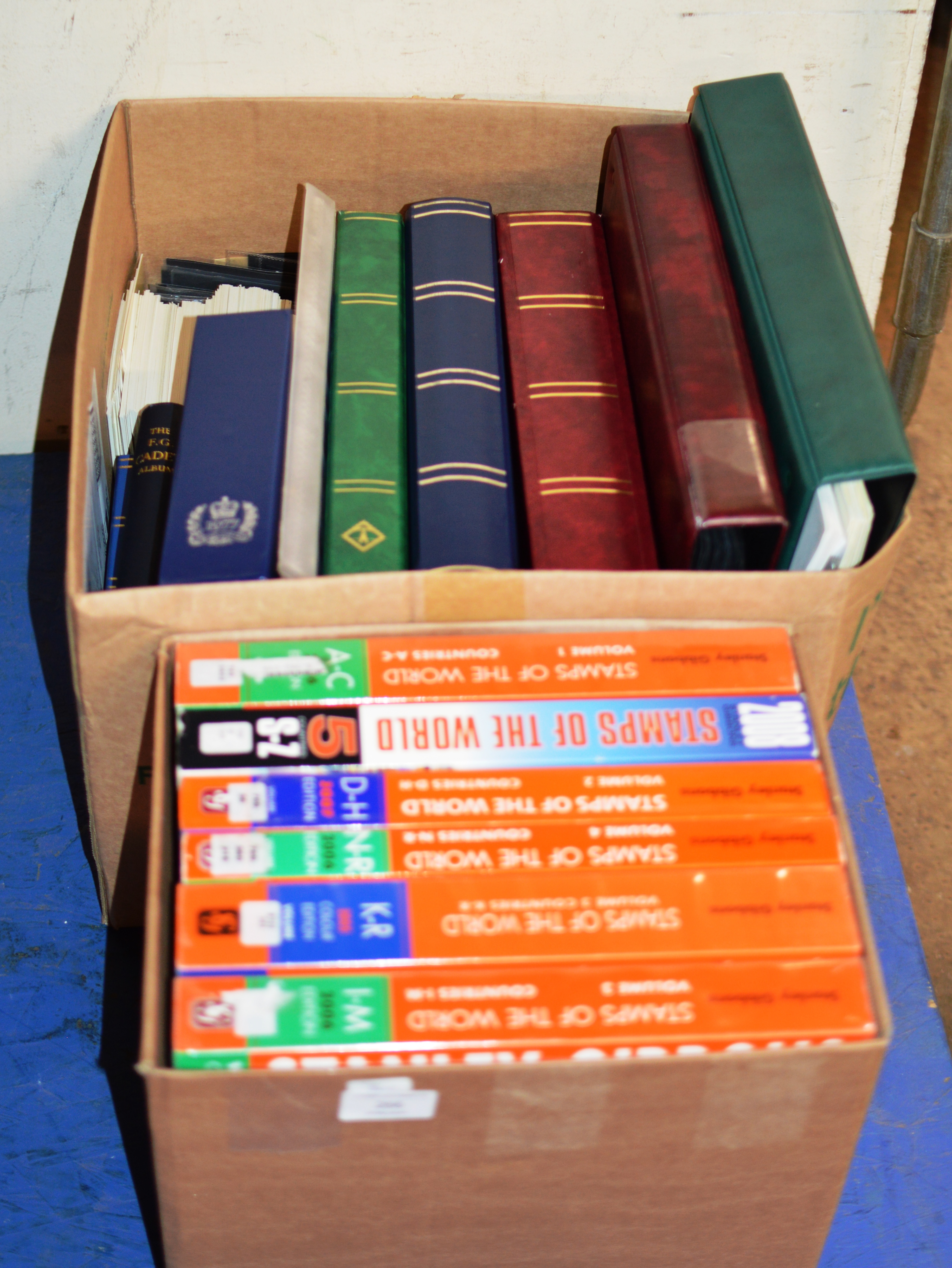 2 BOXES WITH STAMP REFERENCE BOOKS & ALBUMS OF STAMPS