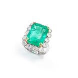 An emerald and diamond cluster ring