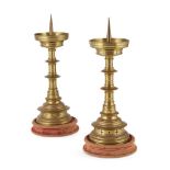 MANNER OF JAMES BROOKS PAIR OF GOTHIC REVIVAL CANDLESTICKS, CIRCA 1880