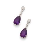 A pair of amethyst and diamond pendent earrings