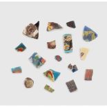 COLLECTION OF ANCIENT GLASS INLAY FRAGMENTS EASTERN MEDITERRANEAN AND NEAR EAST, 1ST MILLENNIUM B.C.