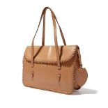 Alaia: A tan leather shoulder bag