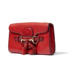 Gucci: A red leather crossbody bag