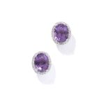 A pair of amethyst and diamond earrings