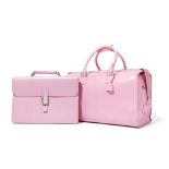 Dunhill: A pink holdall and laptop bag