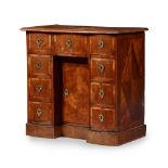 GEORGE I WALNUT AND FEATHERBANDED KNEEHOLE DRESSING TABLE EARLY 18TH CENTURY