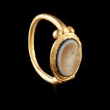 ROMAN GOLD AND INTAGLIO RING CIRCA 2ND - 3RD CENTURY A.D.