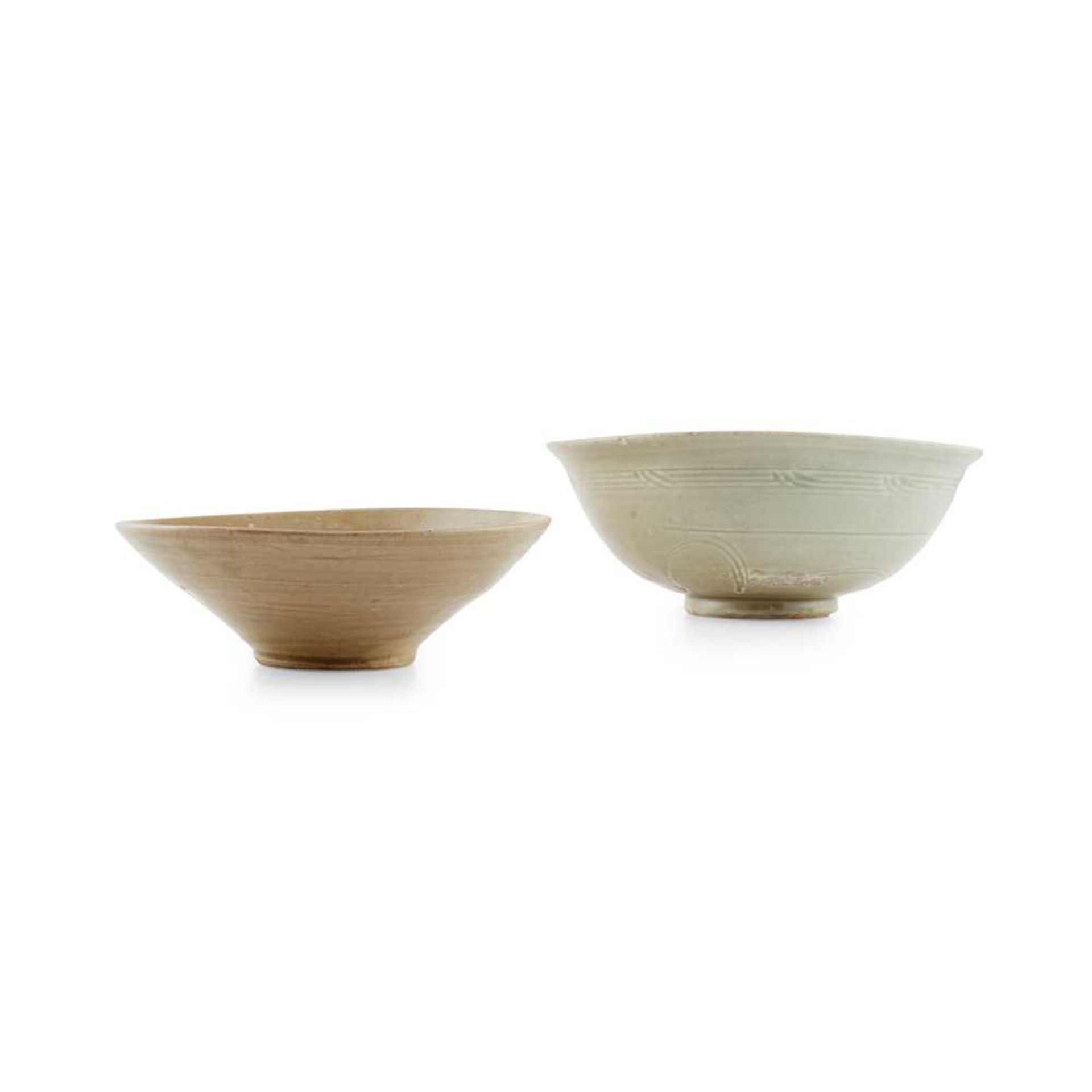 TWO CELADON-GLAZED BOWLS TANG TO YUAN DYNASTY