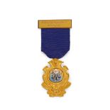 A 9ct gold and enamel medal
