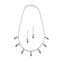 A ruby and diamond necklace and pair of earrings