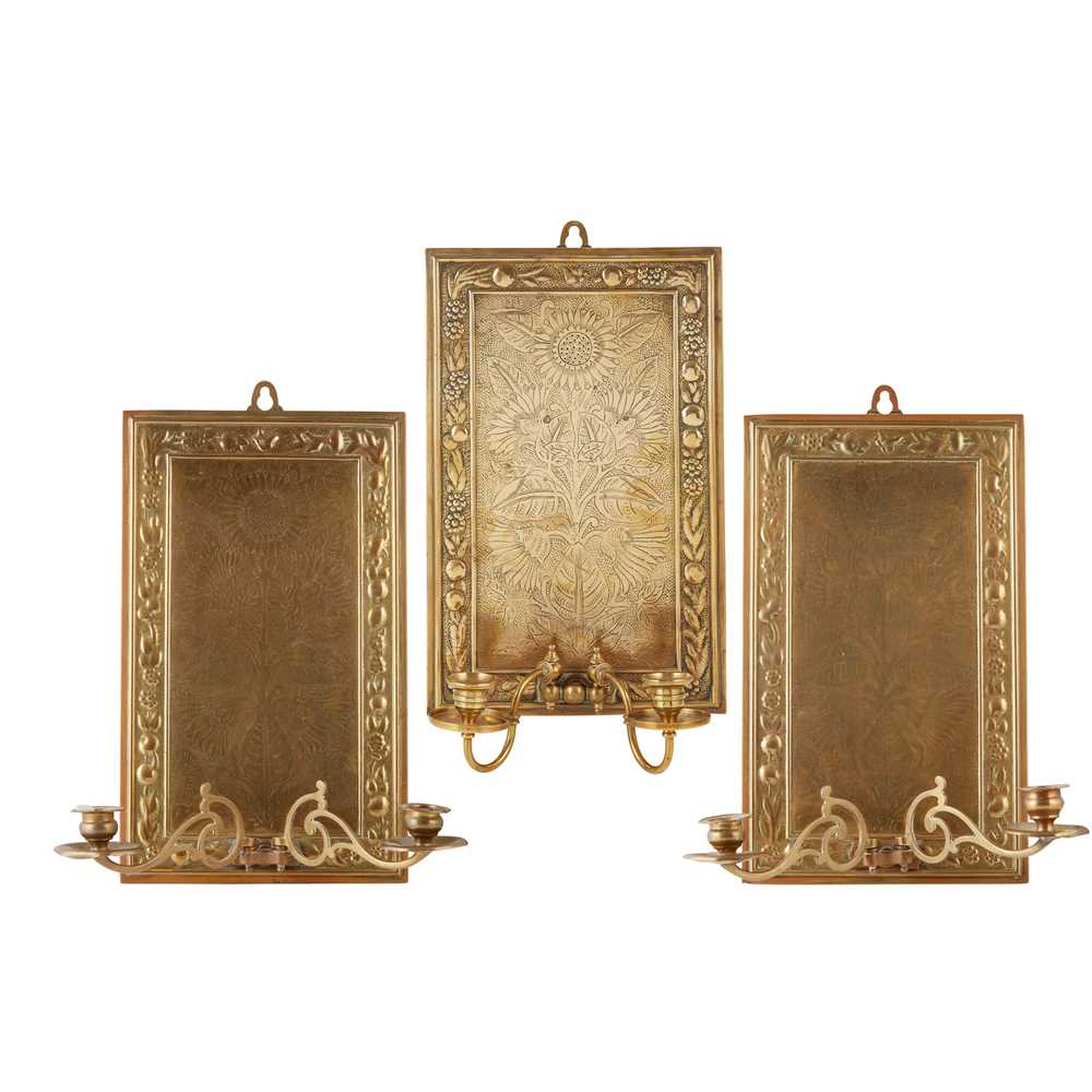 ENGLISH, MANNER OF BRUCE J. TALBERT HARLEQUIN SET OF THREE AESTHETIC MOVEMENT CANDLE SCONCES, CIRCA
