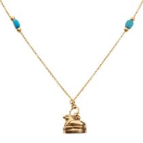 An Egyptian-style locket and chain