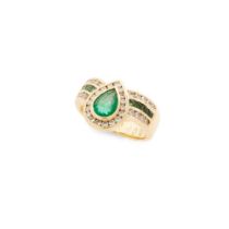 An emerald and diamond dress ring