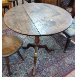 An 18th century Oak tripod table. 69 cm x 67cm diameter.