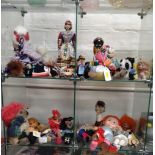 Souvenir dolls, soft toy animals, and a Lledo Grants van.