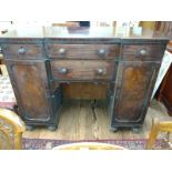 A large Victorian buffet sideboard; flame mahogany, matching panels and a buffet drawer for bottles
