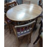 An oak Dining table and chairs. circa 1900. 74cm x 102cm 133cm (centre leaf 38cm)