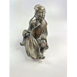 An Asian Antique bronze figure of a sage. Dark brown patination.