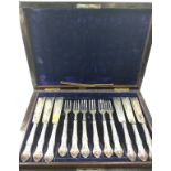 A cased set of 12 fish knives and forks with silver blades. London 1876