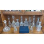 A set of four Edinburgh Crystal golf- subject glasses in original blue box, eight various decanters,